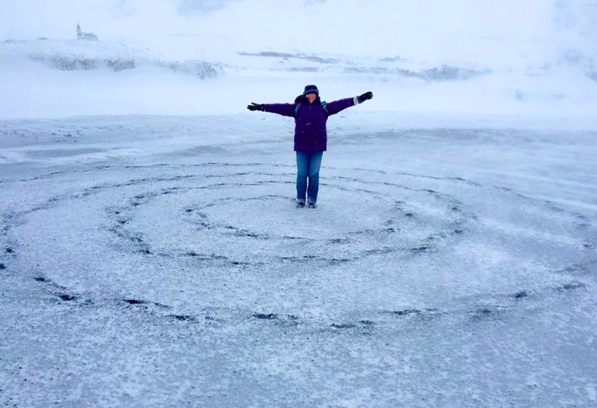Izolda with spiral she made in black sand beach on the south coast of Iceland.