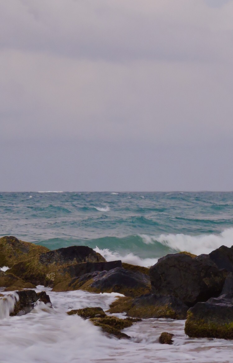 Ocean hitting rocks at shore